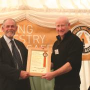 At APF 2012, HSE director Professor Richard Taylor (left) presents Donald Maclean with a certificate recognising the FCA as FISA’s first member.