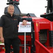 Ufkes Greentec’s Mark Jibson with the 942 on a Valtra.