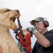 Working on the Cougar carving at Carrbridge in 2009.