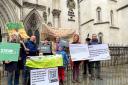 Alison White, founder of campaign group Save the Trees of Armada Way (Straw), (centre) with fellow campaigners outside the Royal Courts of Justice in London.