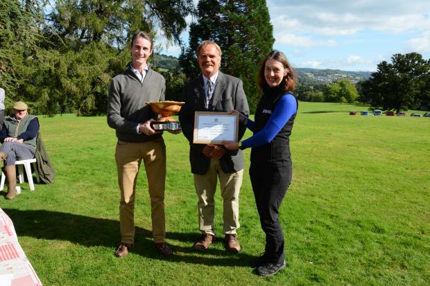 Forestry Journal: Harry Chichester collects the RFS Silviculture Award for Excellence from South Wales Division chair Chris Jones and Sonia Winder from sponsors Tilhill.
