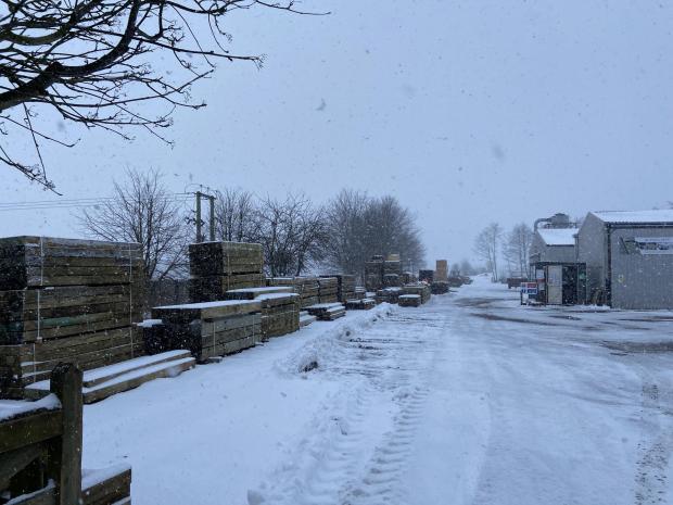 Forestry Journal: Partially hidden by a dusting of snow is the well-organised yard of Ford and Etal Sawmill.