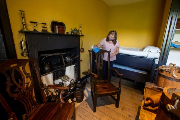 Phyllis Crossan, visitor experience assistant at
the David Livingstone Birthplace Museum, in the room where Livingstone was born in 1813