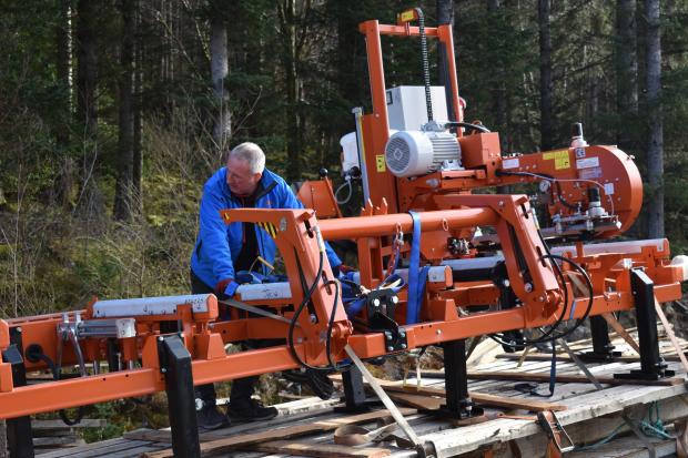 Forestry Journal: Keith considers the best way to get the mill off the trailer and into the shed.