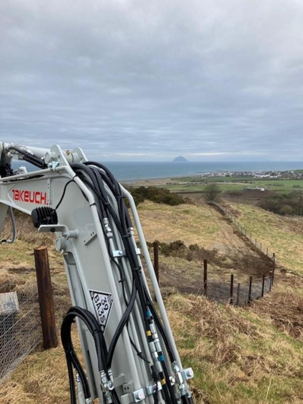 Forestry Journal: Some of the 39,000 metres of fencing that was erected on the Glenapp Estate with Ailsa Craig in the background.