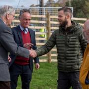 Michael Wilson of Scottish Woodlands is greeted by the Duke of Gloucester at Lauder Common, watched by Tweed Forum Director Luke Comins.