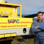Tom Vaughan of Vertical Tec Concepts with his tractor-mounted platform.