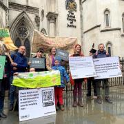 Alison White, founder of campaign group Save the Trees of Armada Way (Straw), (centre) with fellow campaigners outside the Royal Courts of Justice in London.