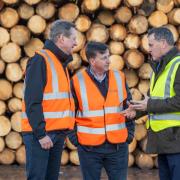Douglas Alexander (centre) is pictured with Stuart Goodall (left), Chief Executive of forestry and wood trade body Confor and Pat Glennon (right)